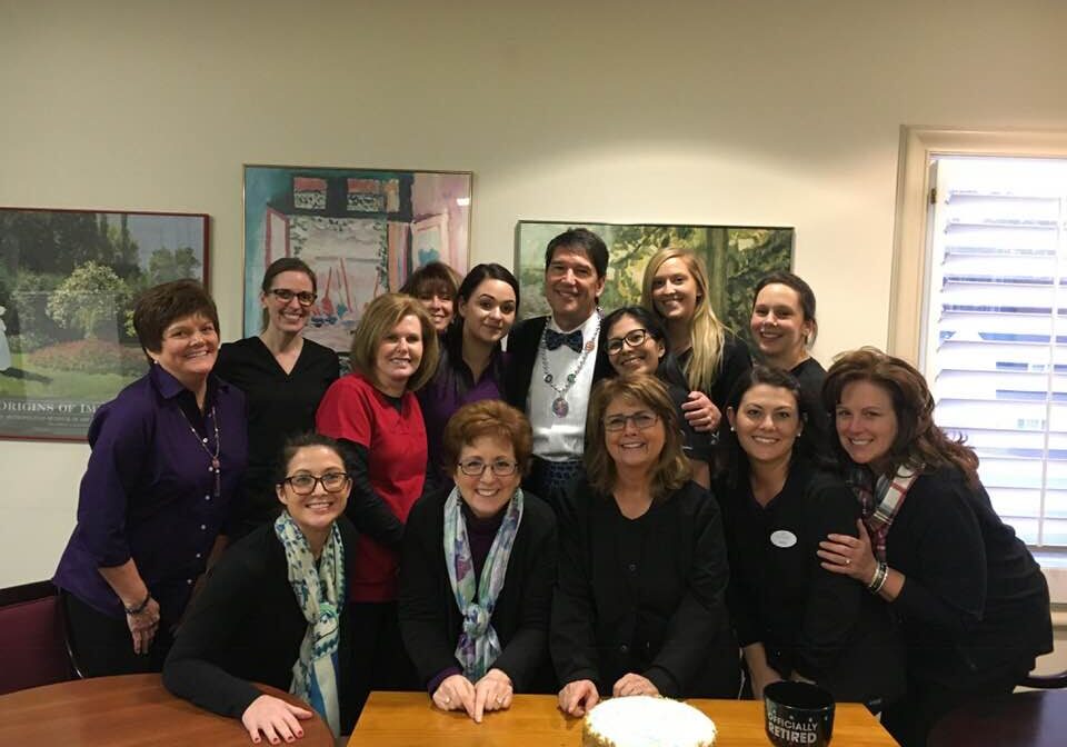 Dr. Hyman with dental team at retirement party