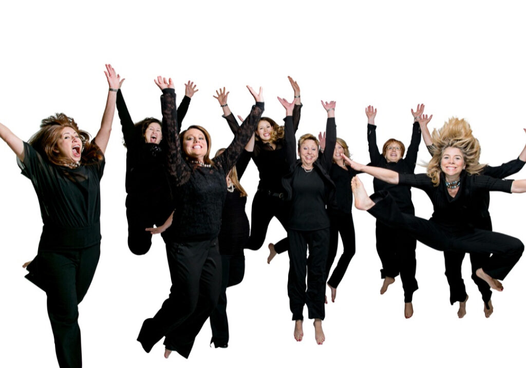 Mark Hyman DDS team jumping up in the air